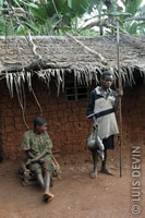 Pygmy hunter with spear and antelope