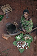 Pygmy woman with rain forest products
