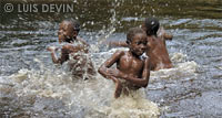 Pygmy water drums played by children